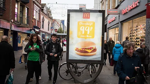 OLI SCARFF/AFP/Getty Images £1 meals aren't common in the UK, but pricing wars in the US could prompt international franchisees of companies like McDonald's to try their luck (Credit: Getty Images)