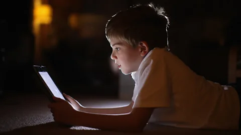 Christopher Furlong/Getty Images One of the defining traits of Gen Z is that they were raised on digital, internet-connected devices, whereas Millennials had to adapt to them (Credit: Getty Images)