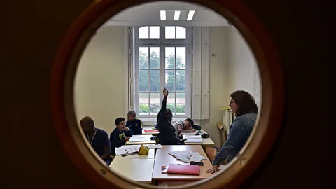 Christophe Archambault/AFP/Getty Images Experts say that young people currently in school or getting ready to graduate from university are driven people with strong work ethic (Credit: Getty Images)