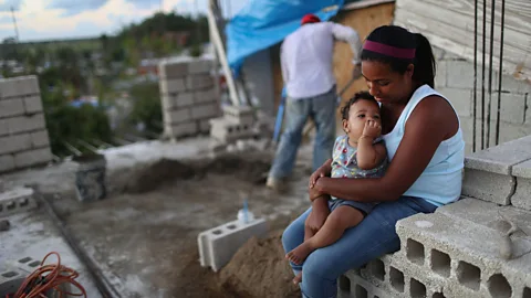 Mario Tama/Getty Images This neighbourhood in Puerto Rico was still without power as of December 2017, three months after Hurricane Maria hit the country (Credit: Getty Images)