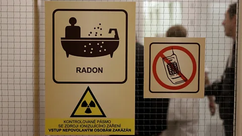 Matthew Vickery Stickers adorn entrance to an area where radon water therapy is carried out, warning of radioactive material (Credit: Matthew Vickery)