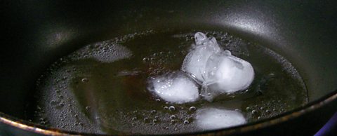 Ice in a hot pan, melting to water which is boiling to water vapour
