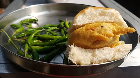 Charukesi Ramadurai Vada pav is a deep-fried potato patty served on a soft bread roll with spicy green chilli (Credit: Charukesi Ramadurai)