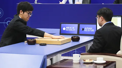 Getty Images The world's top human player of Go,19-year-old Ke Jie, tries to beat AI program AlphaGo during a DeepMind Challenge Match (Credit: Getty Images)