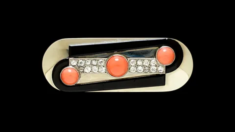 V&A / American Friends of the V&A Raymond Templier's white-gold, brilliant-cut diamonds, onyx and coral brooch, made in 1930, is in the V&A's collection (Credit: V&A / American Friends of the V&A)