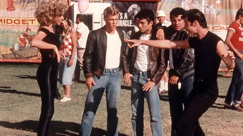 Alamy In Grease, the wolf-whistle pops up to help create the sexy 1950s mood (Credit: Alamy)