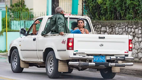 Roberto Machado Noa/Getty Images Locals who have access to a vehicle were obliged to pick up hitchhikers, because there were so many more people than cars (Credit: Roberto Machado Noa/Getty Images)