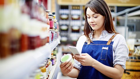 Woman checking label on food