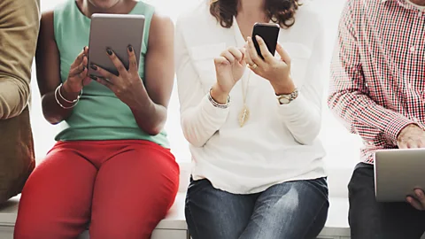 Getty Images "Cheers" is an acceptable sign-off for UK emails, but it can be perplexing for people who know it only as something said when clinking pints at the pub (Credit: Getty Images)