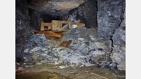Robin Friend Some of the underground structures built in the slate mine at Manod are still standing today – and discarded art storage materials can be found (Credit: Robin Friend)