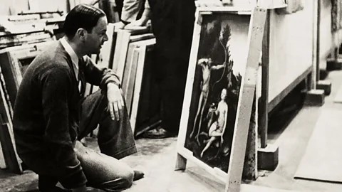 Getty Images Legendary art historian Kenneth Clark, examining Lucas Cranach’s Apollo and Diana in a Manod slate mine storage room, was the National Gallery’s curator (Credit: Getty Images)