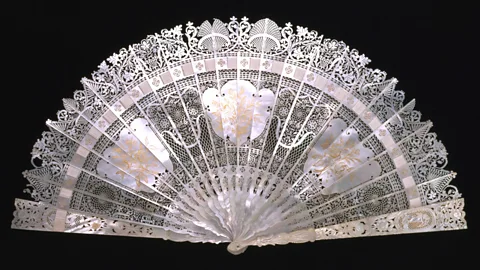Victoria and Albert Museum, London A delicately carved mother-of-pearl fan made in in the 1800s is among the show’s exhibits (Credit: Victoria and Albert Museum, London)