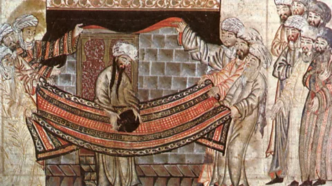 Alamy This illustration from the Mongol history text called the Jami al-Tawarikh shows the elders of Mecca placing the Black Stone in the Kaaba (Credit: Alamy)