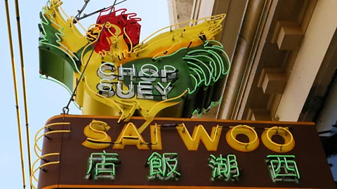 Mike MacEacheran Owner Salli Pateman raised nearly C$20,000 to locate and restore the Sai Woo restaurant’s original neon sign (Credit: Mike MacEacheran)