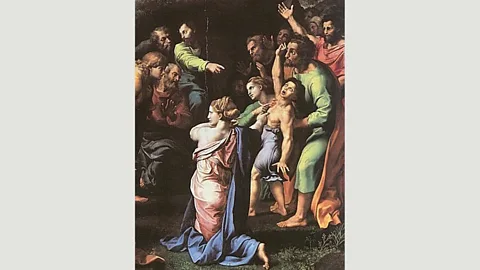 Wikimedia Raphael’s The Transfiguration (1518-1520) has similar elements to Gonzalez’s photo: flung arms, finger pointing and beatific expressions (Credit: Wikimedia)