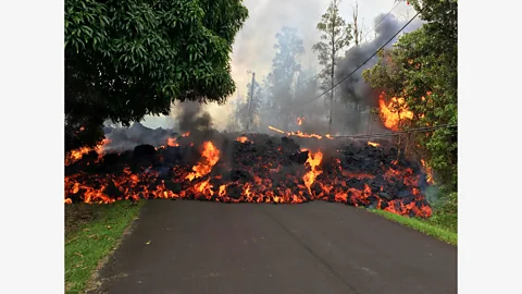 Getty Images Lava flows down Makamae Street in Leilani Estates, Hawaii on 6 May – the eruption of Kilauea forced the evacuation of 1,700 residents (Credit: Getty Images)