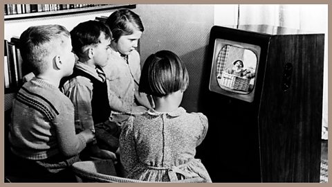 An early television - children watch an early black and white television