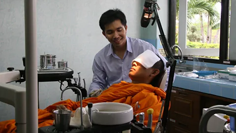 Alamy Syndromes and a Century opens with a minutes-long take of people talking off-camera while Apichatpong’s lens is trained on an empty field – reverie is the goal (Credit: Alamy)