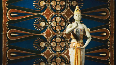 Gemeentemuseum Den Haag The glazed, painted earthenware Purmerand Javan dancer is by Carel Wirtz, and the silk batiked cloth is by Bertha Blake (Credit: Gemeentemuseum Den Haag)