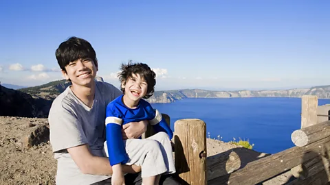 Getty Images Employers were more likely to ask male babysitters how much they expected to earn but told young women what the rate was (Credit: Getty Images)