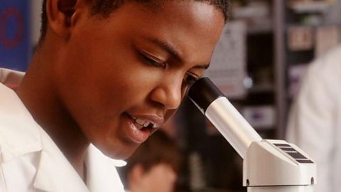 Looking through a microscope