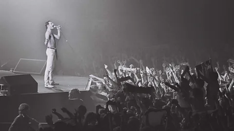 Getty Images We Are the Champions by Queen (Freddie Mercury, pictured) is a popular song for football fans: it was chanted by fans of the winning team at Euro 2004 (Credit: Getty Images)