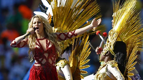 Getty Images Colombian pop star Shakira recorded the official anthems for the 2010 and 2014 World Cups – pictured, at the closing ceremony of the 2014 tournament (Credit: Getty Images)