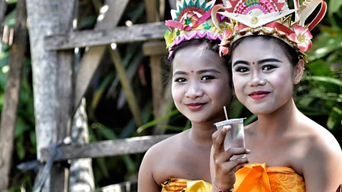 Mark Eveleigh At 11 years old, Ayu (pictured right) is one of the village’s most talented traditional dancers (Credit: Mark Eveleigh)
