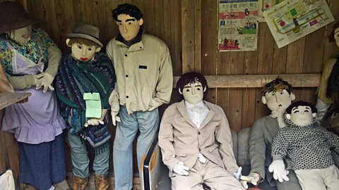 Don George The scarecrows’ faces are made from white cloth, with buttons for eyes and black yarn for eyebrows (Credit: Don George)