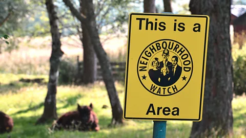 Getty Images If a neighbourhood watch worked – and crime went down – would volunteers then relax? Not exactly (Credit: Getty Images)