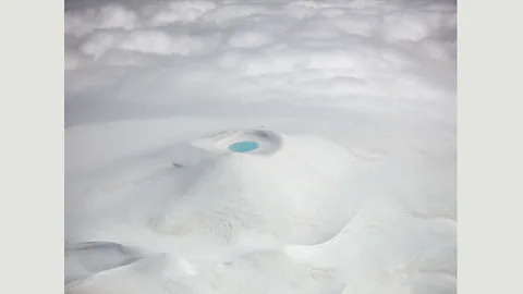 Antony Spencer Hekla volcano: “This was the unexpected view, a crater completely covered in snow after a late winter in the mountains of Iceland” – Antony Spencer (Credit: Antony Spencer)