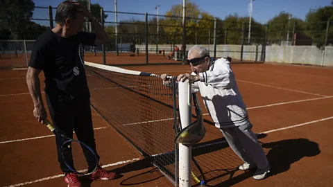 Getty Images Can't stop, won't stop. Armenian-born Argentine 100-year-old Artyn Elmayan stretches before a tennis session (Credit: Getty Images)