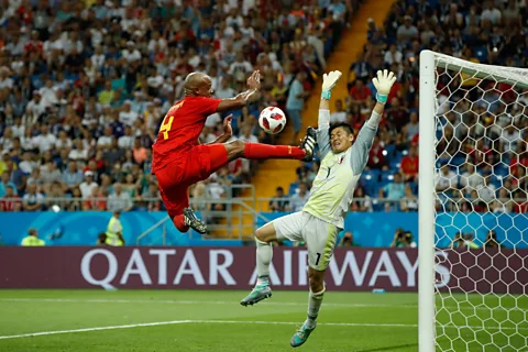 Getty Images Belgium’s defender Vincent Kompany (left) tries to score against Japan’s goalkeeper Eiji Kawashima during the match between Belgium and Japan on 2 July (Credit: Getty Images)