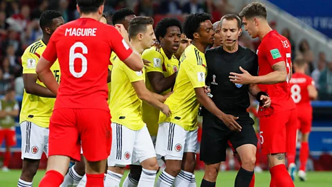EPA Players react as US referee Mark Geiger awards a penalty during the match between Colombia and England on 3 July (Credit: EPA)