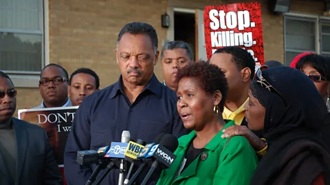 Getty Images Jesse Jackson stands with Rose Braxton at a 2009 rally in South Side, Chicago; Braxton’s 16-year-old nephew was beaten to death in a brawl (Credit: Getty Images)