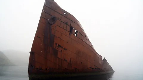 John Zada The SS Northwestern, a steamship destroyed in a WWII Japanese attack, still rises above the water's surface (Credit: John Zada)