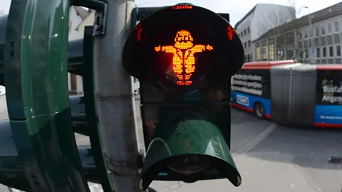dpa picture alliance/Alamy Traffic lights in the centre of Trier feature caricatures of Karl Marx (Credit: dpa picture alliance/Alamy)