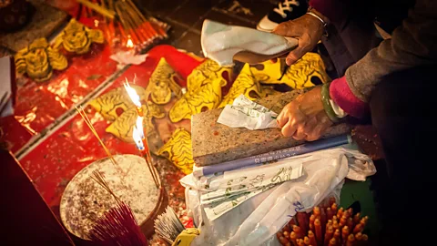 Paul Rushton/Alamy Although it may look extremely modern, Hong Kong preserves many ancient traditions, including the art of ‘Villain Hitting’ (Credit: Paul Rushton/Alamy)