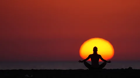 Getty Images Some of the world’s biggest companies have embraced minfulness, using meditation programmes as a way of tackling stress, staff turnover and absenteeism (Credit: Getty Images)