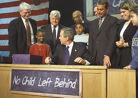 President George W. Bush signs into law the No Child Left Behind Act