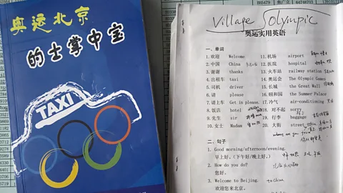 Getty Images In preparation for the 2008 Olympic Games, Beijing taxi drivers studied this textbook to serve English-speaking visitors (Credit: Getty Images)