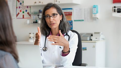 Female doctor talking to patient
