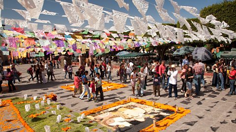 Flags and marigolds laid out for Day of the Dead festival