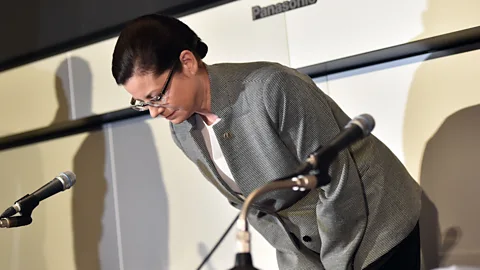 Getty Images McDonald's Japan president Sarah Casanova bows her head in apology as she announces the company's restructuring plan at the Tokyo Stock Exchange (Credit: Getty Images)