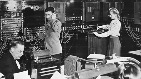 Getty Images Operators in the Muzak master control room monitor background music programs and make adjustments in New York in 1950 (Credit: Getty Images)