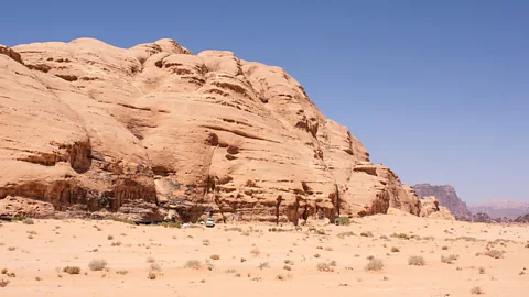 Amanda Ruggeri The sheikh’s home – for now – was tucked into the shade of a massive rock mountain (Credit: Amanda Ruggeri)