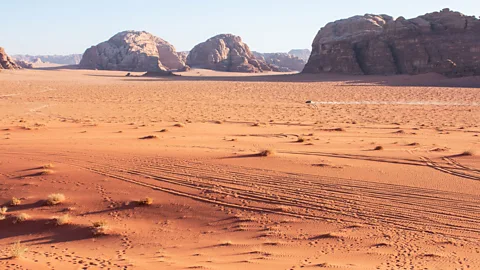 Amanda Ruggeri View of Wadi Rum, Jordan, with a vehicle in the distance
