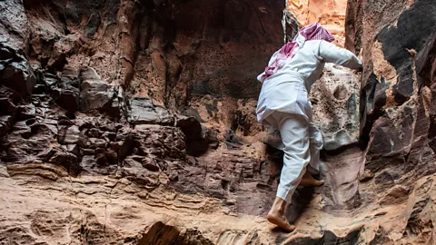 Amanda Ruggeri One of Abu Rashid’s skills: scrambling up canyon walls with ease (Credit: Amanda Ruggeri)