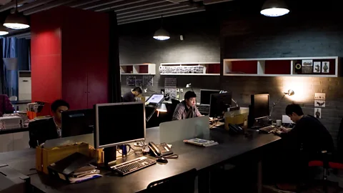 Getty Images Over 400 million employed persons worldwide work 49 or more hours per week according to the ILO (Credit: Getty Images)