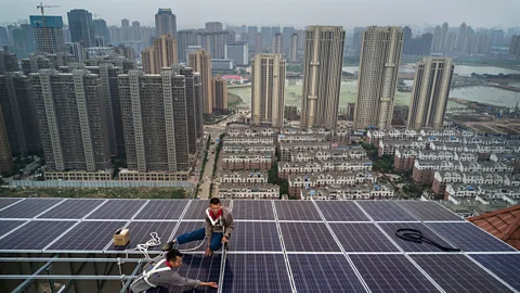 Getty Images Given the inefficiency of transmitting electricity over large distances, rooftop solar panels tend to be more efficient than remote solar farms (Credit: Getty Images)